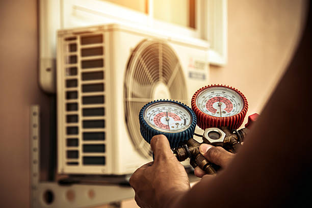 Professional Heat Pump Repair technician working in Monticello, IA